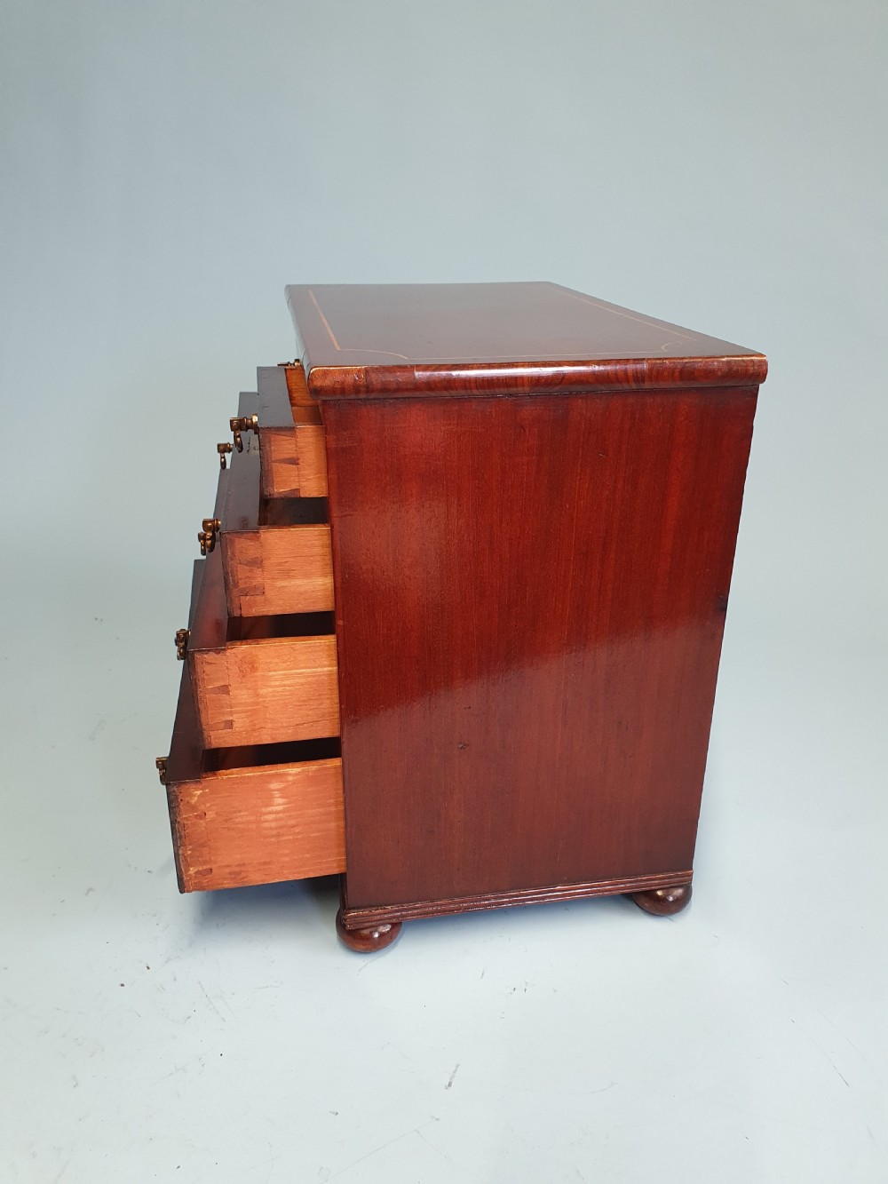 Early 19th century miniature 2/3 mahogany chest of drawers dated 1824. View IV