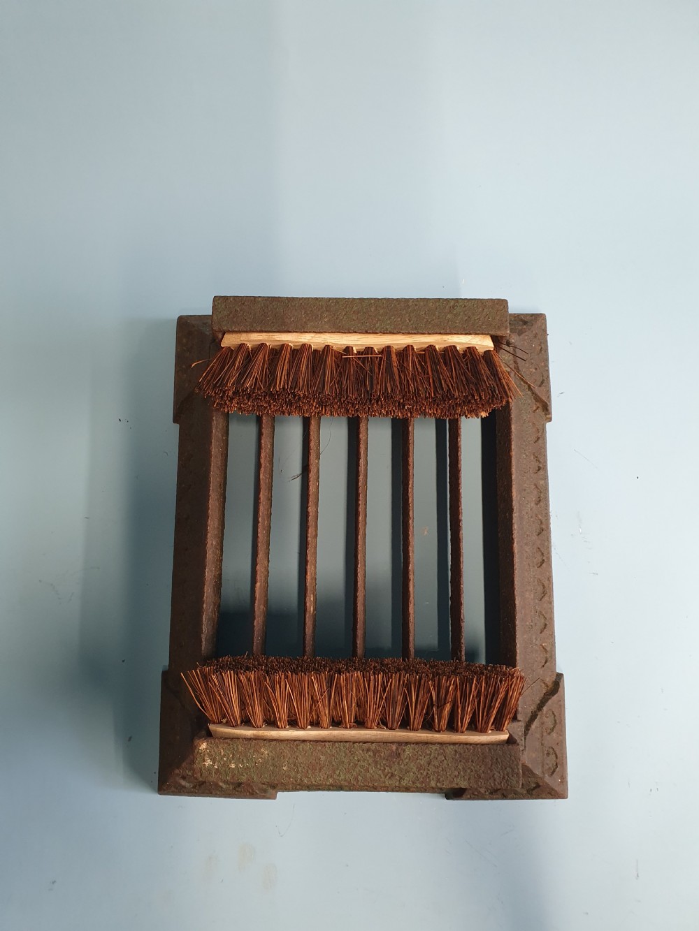 Late 19 century cast iron boot scraper with brushes to the side View IV