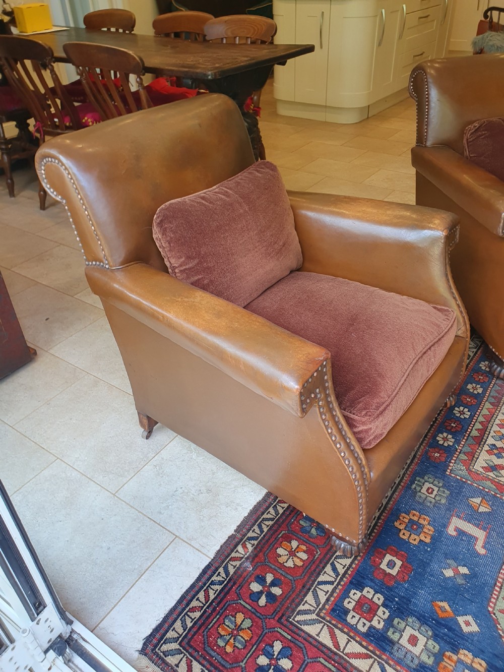 Early 20th century pair of chocolate brown leather chairs View V