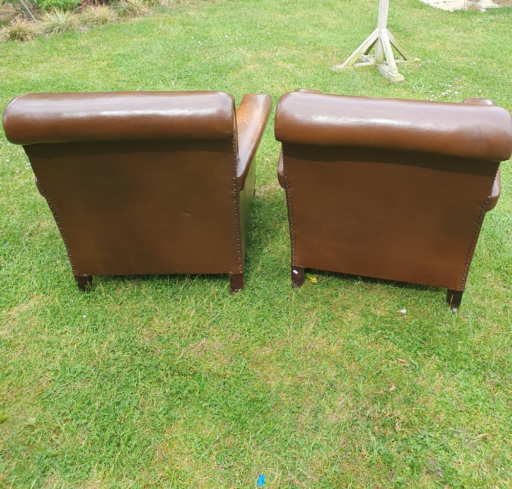 Early 20th century pair of chocolate brown leather chairs View VIII