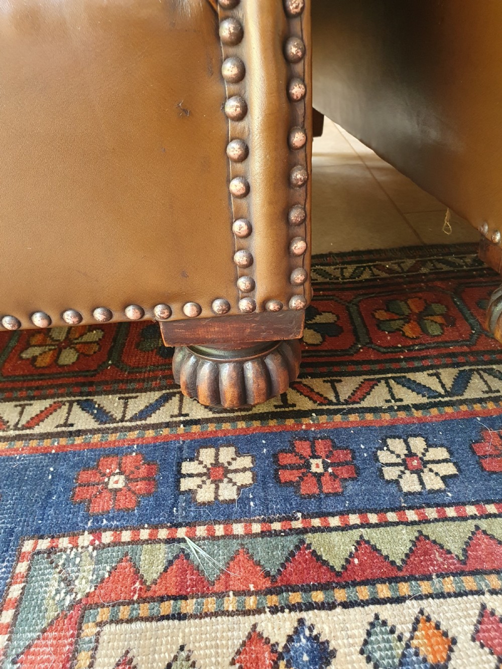 Early 20th century pair of chocolate brown leather chairs View IX