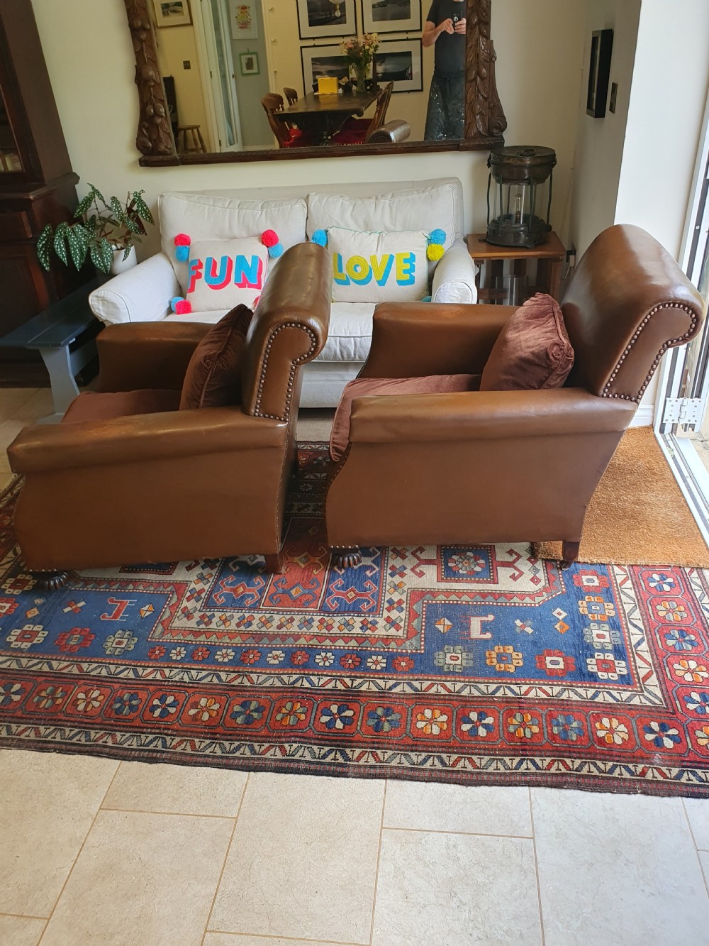 Early 20th century pair of chocolate brown leather chairs View X