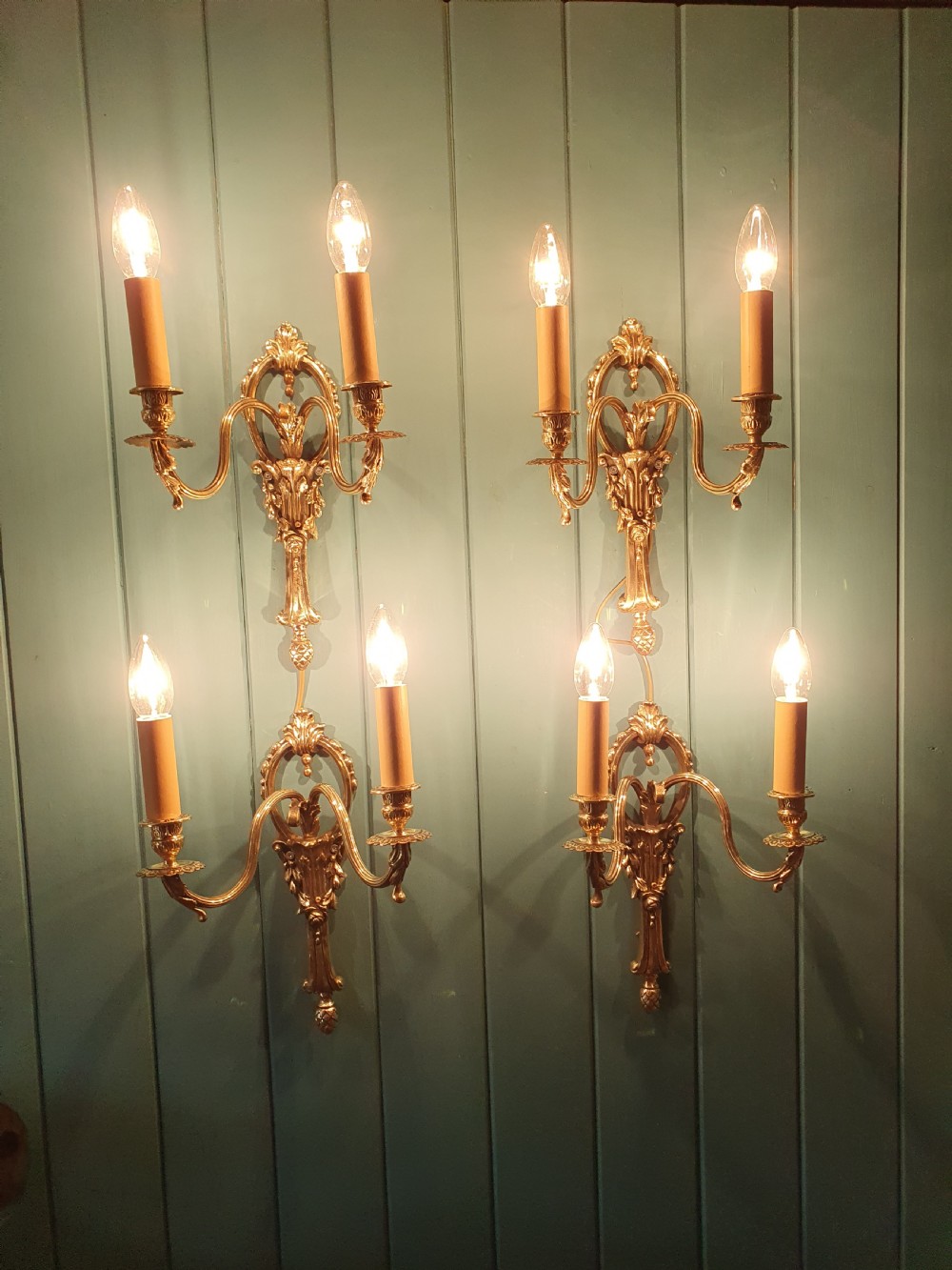 Set of four early 20th century brass wall lights with leaf and acorn design. View II