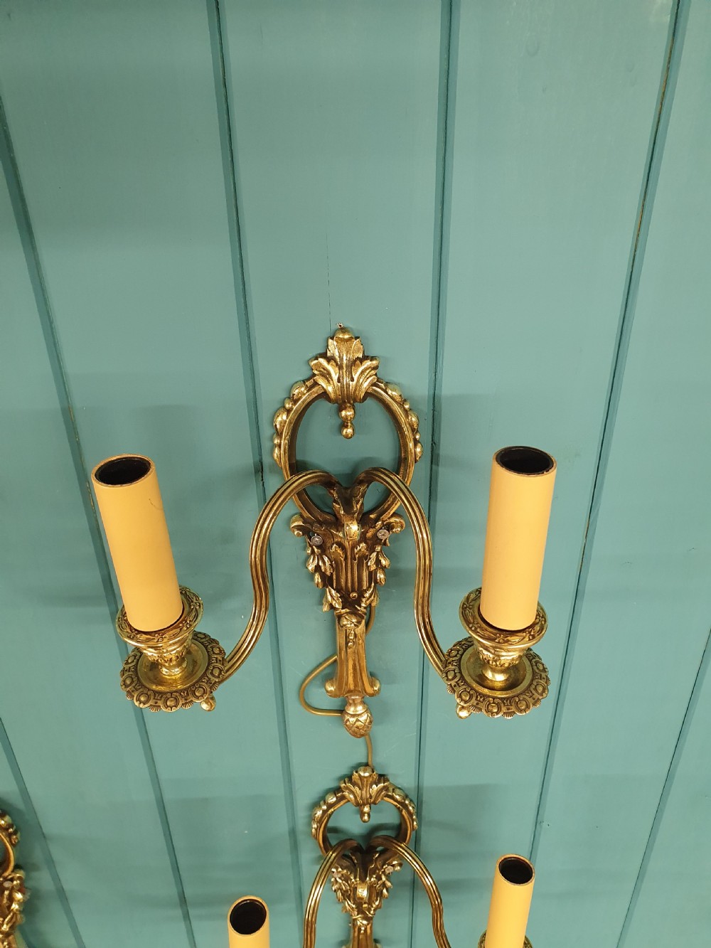 Set of four early 20th century brass wall lights with leaf and acorn design. View V