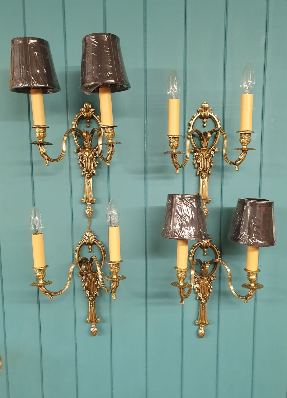 Set of four early 20th century brass wall lights with leaf and acorn design. View VI