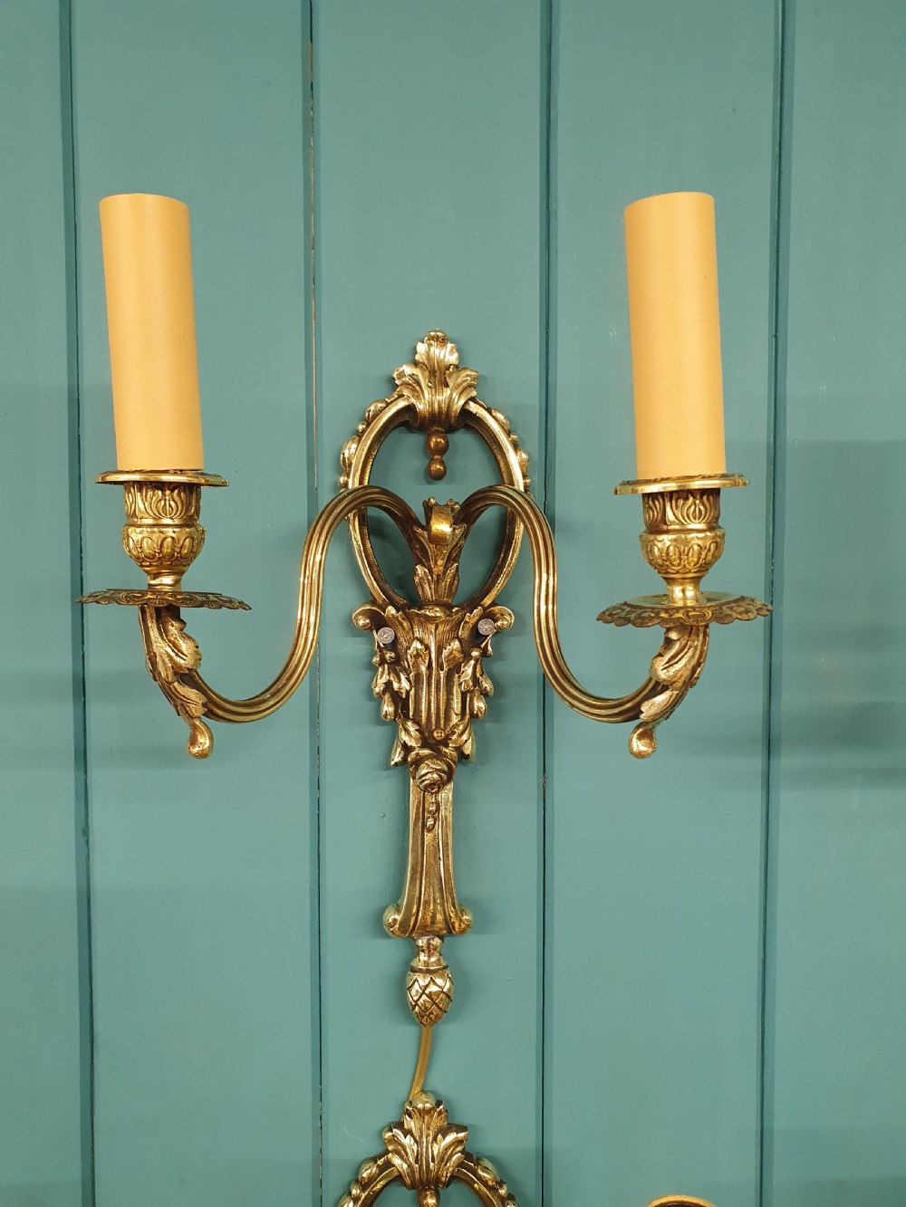 Set of four early 20th century brass wall lights with leaf and acorn design. View IX