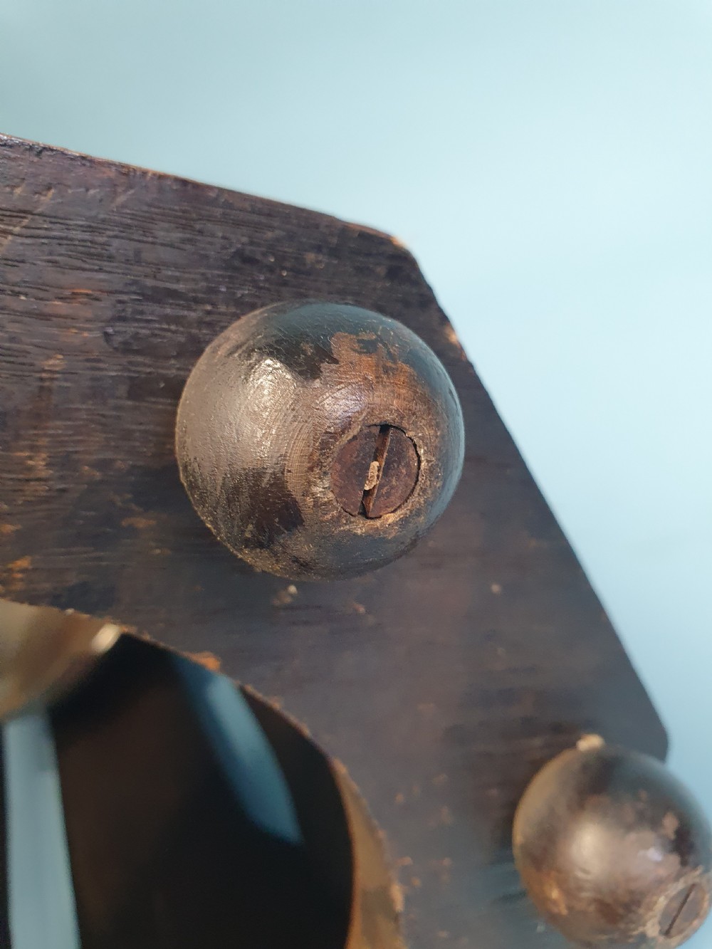 An early 20th-century dark wood octagonal stick stand featuring slatted vertical panels and an internal circular divider ring. View V
