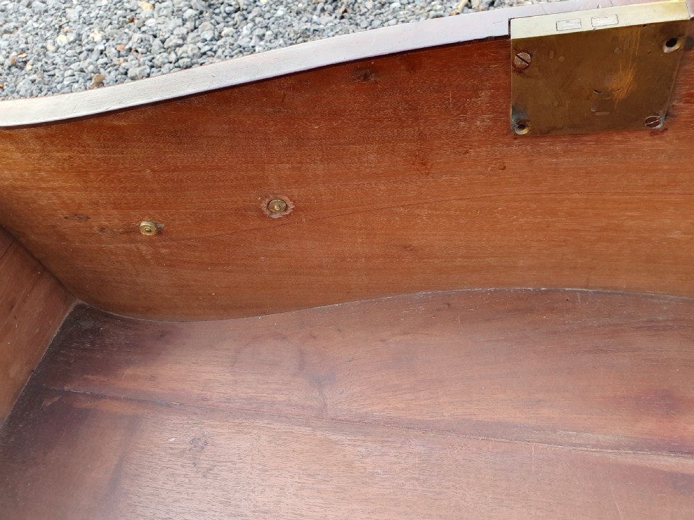 A Georgian mahogany serpentine chest of drawers featuring a curved three-drawer front, brass swan-neck handles, and shaped bracket feet. View VIII