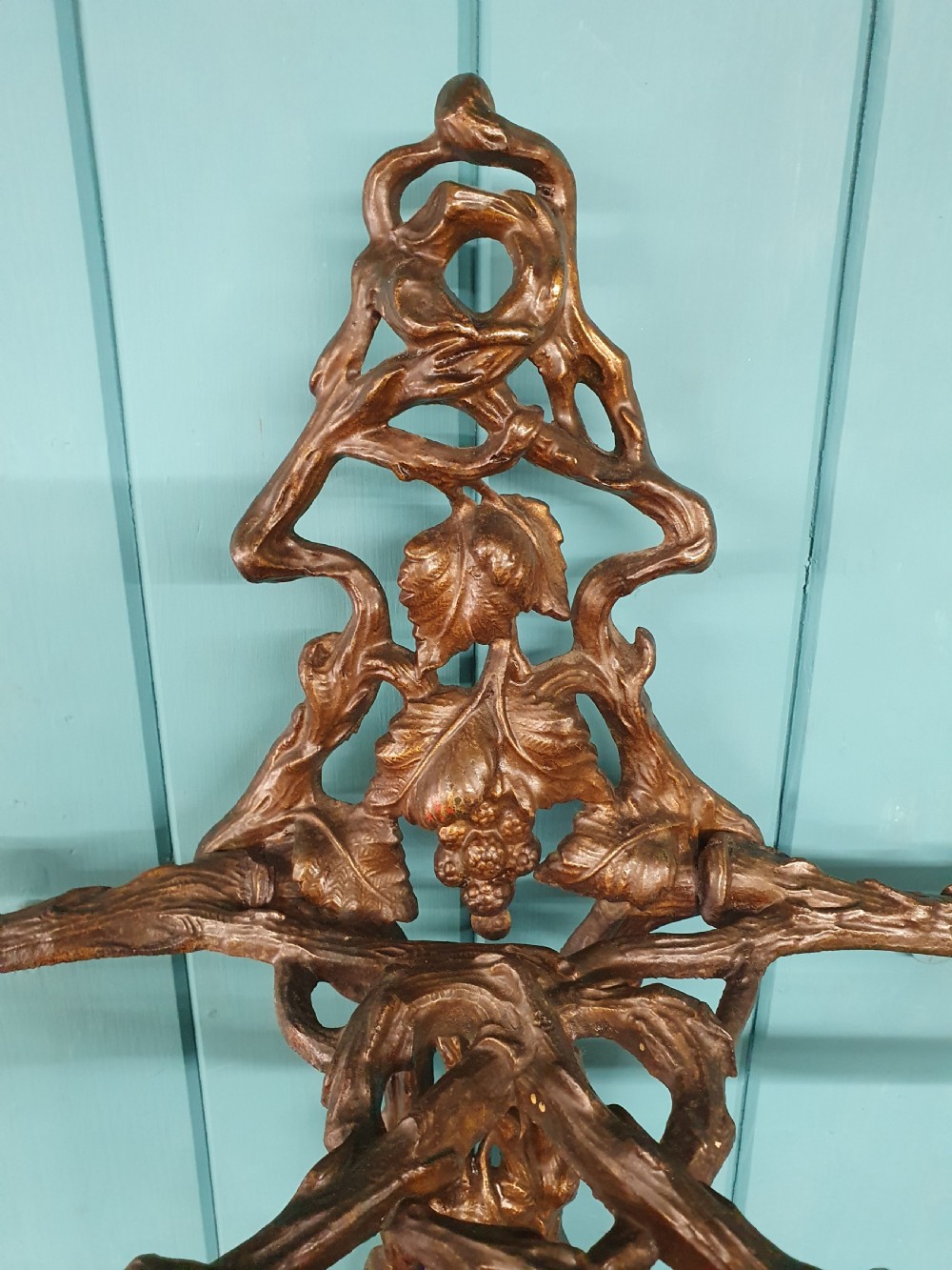 A Victorian cast iron stick stand featuring naturalistic branch and foliage decoration with a drip tray base. View VI