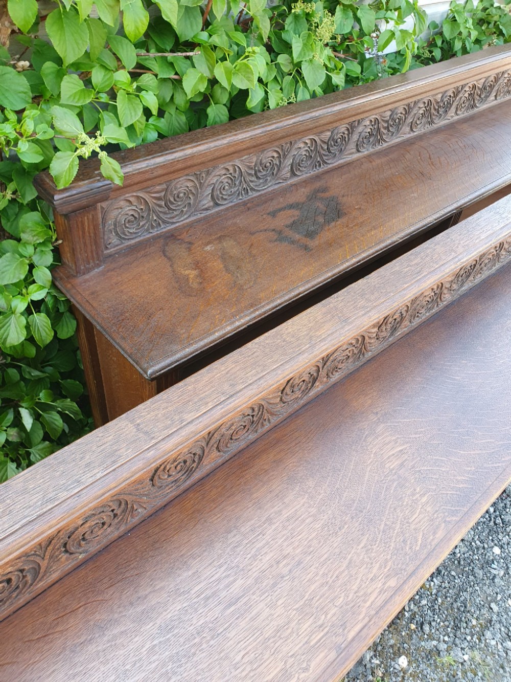A pair of 19th-century low oak bookcases featuring carved scrollwork back galleries and open twin-bay shelving. View VI