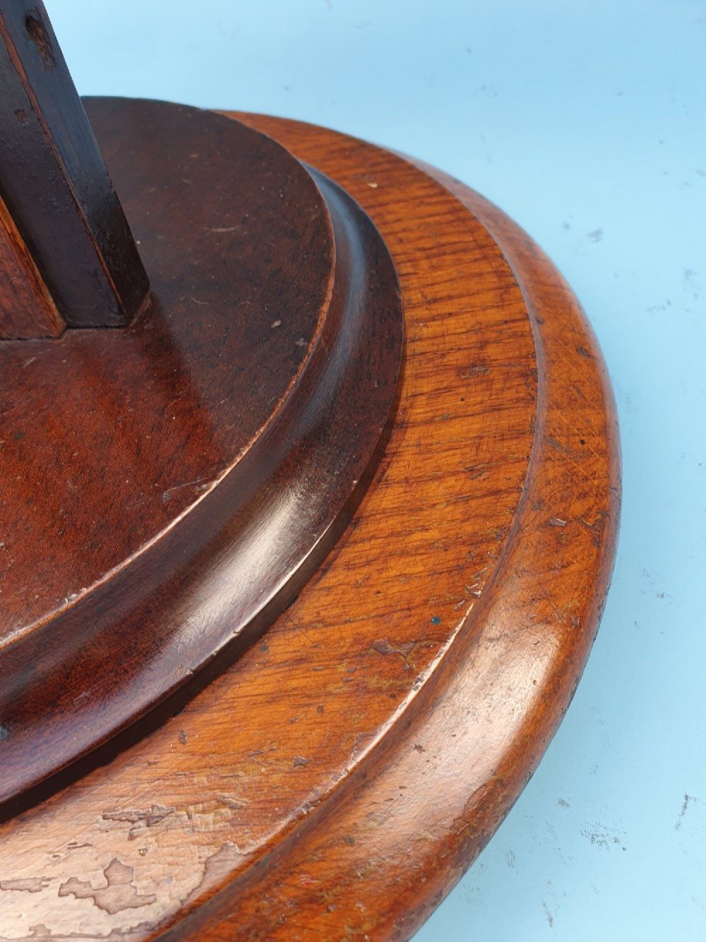 An Art Deco wooden standard lamp featuring a stepped skyscraper column design set upon a circular turned base with a brass light fitting. View VI