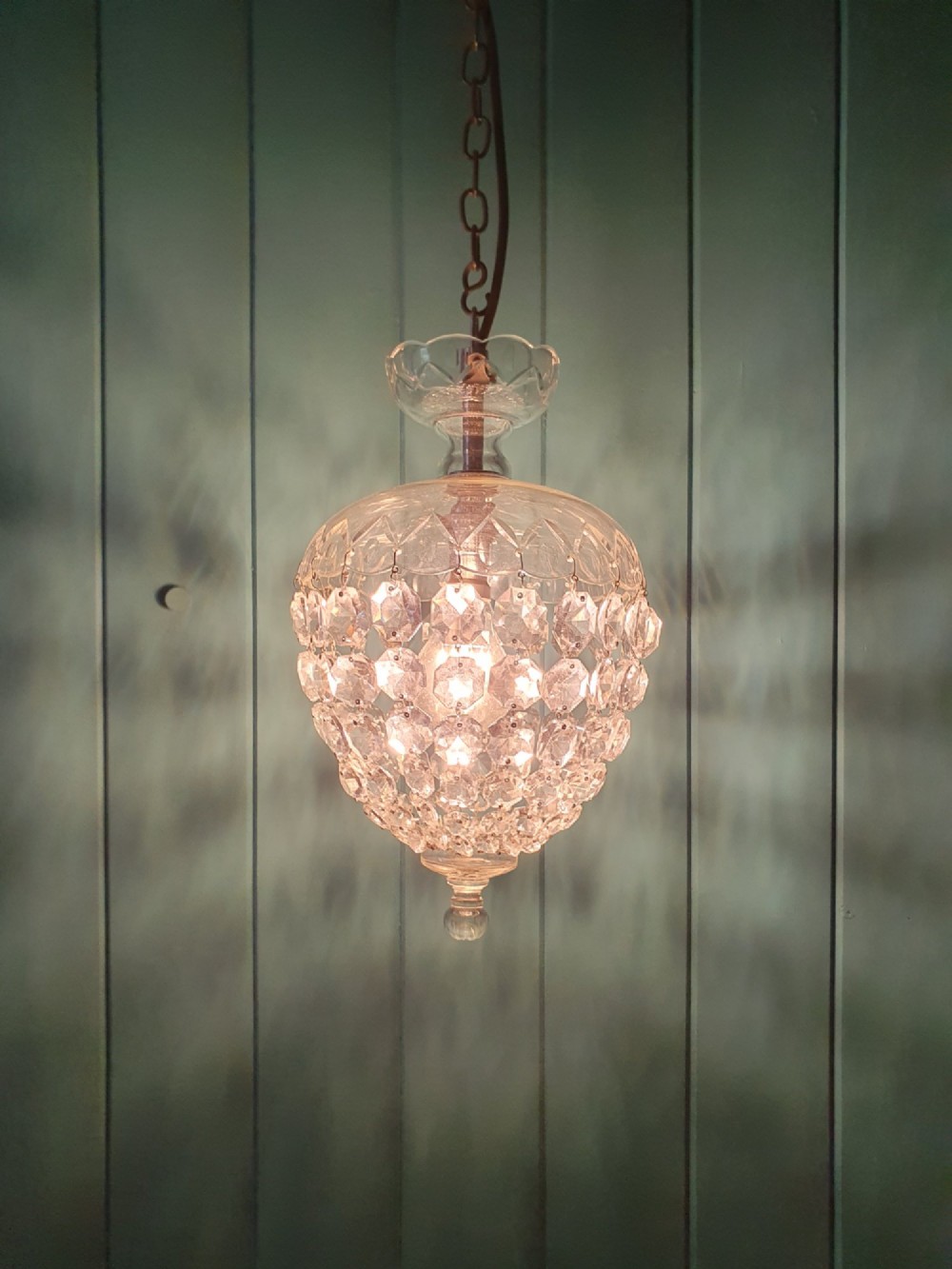 An early 20th-century crystal dome top pendant chandelier with faceted glass beads and a brass chain suspension. View II