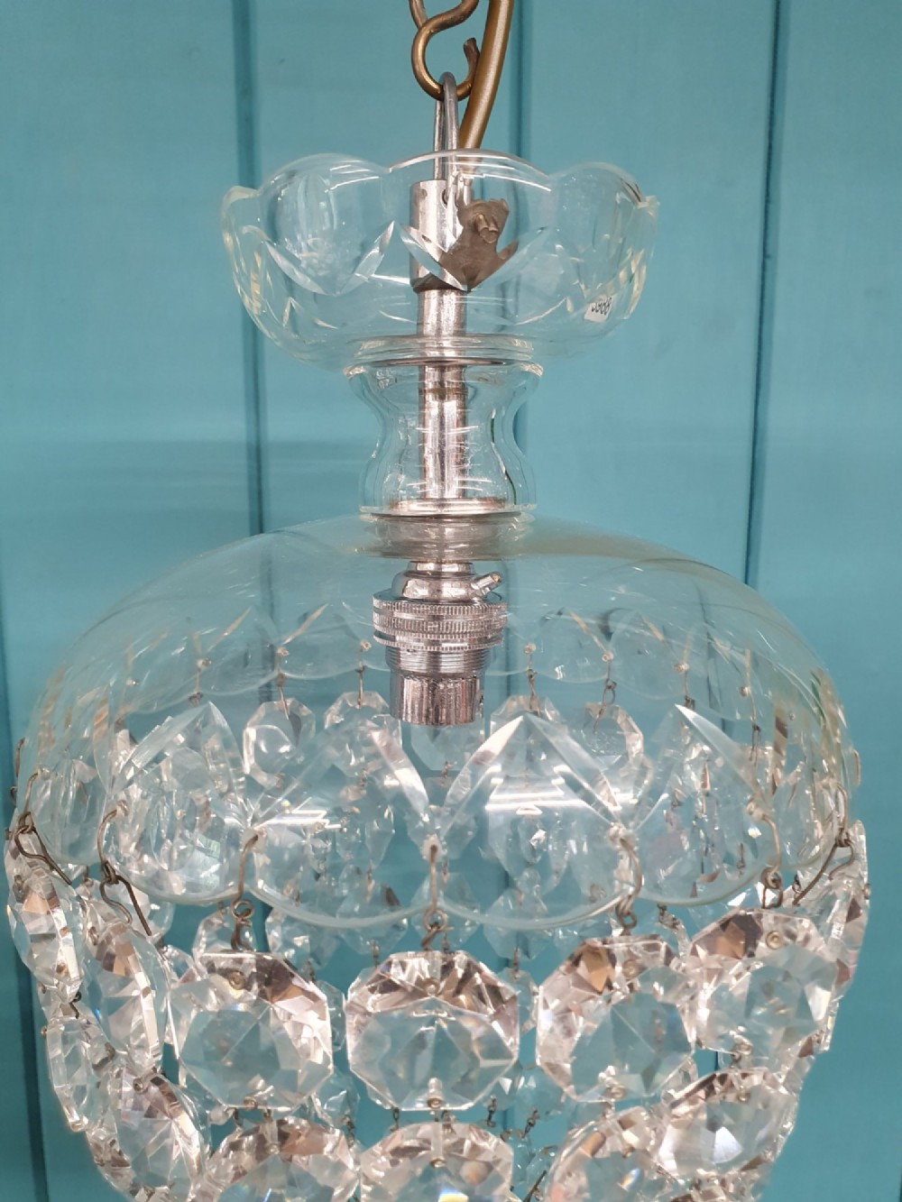 An early 20th-century crystal dome top pendant chandelier with faceted glass beads and a brass chain suspension. View VI
