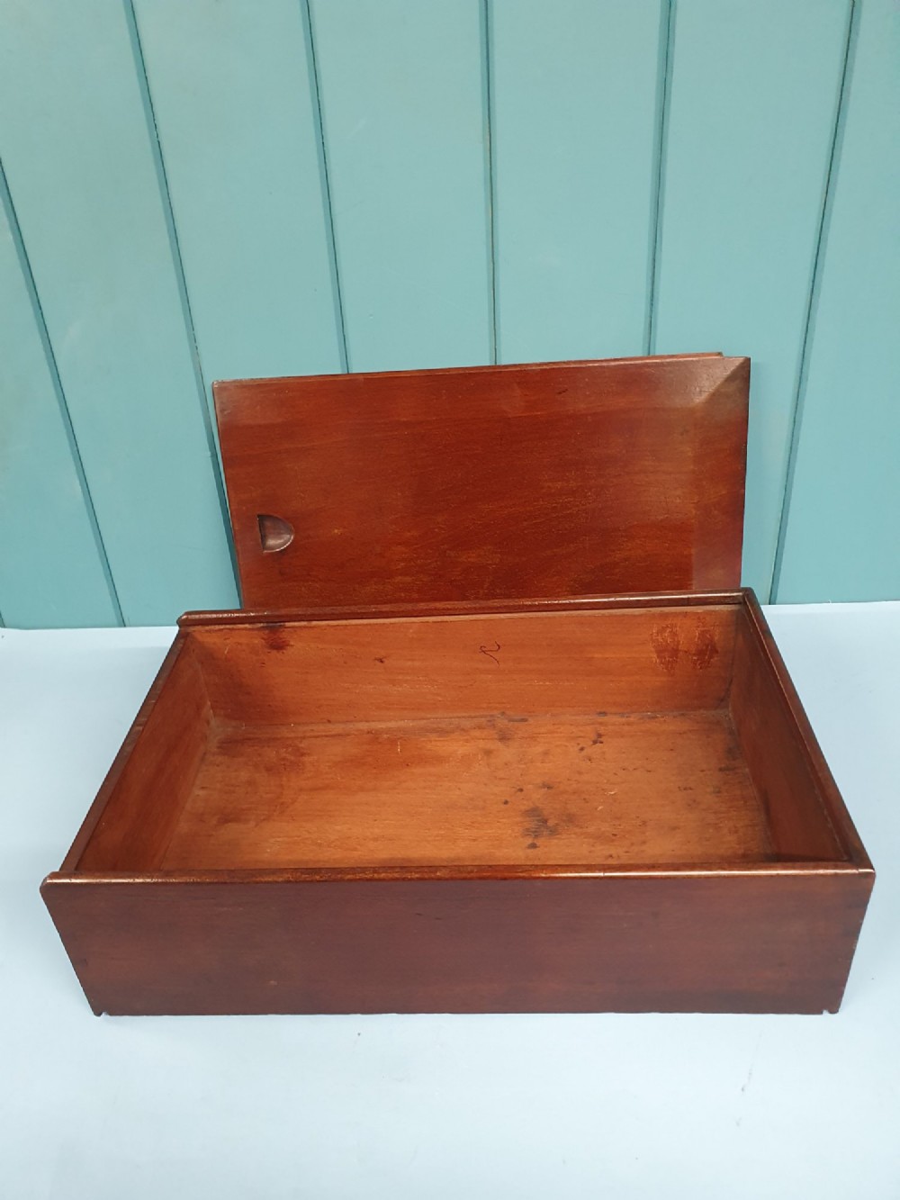 A rectangular Georgian mahogany document box featuring a sliding lid mechanism and warm brown wood grain finish. View II