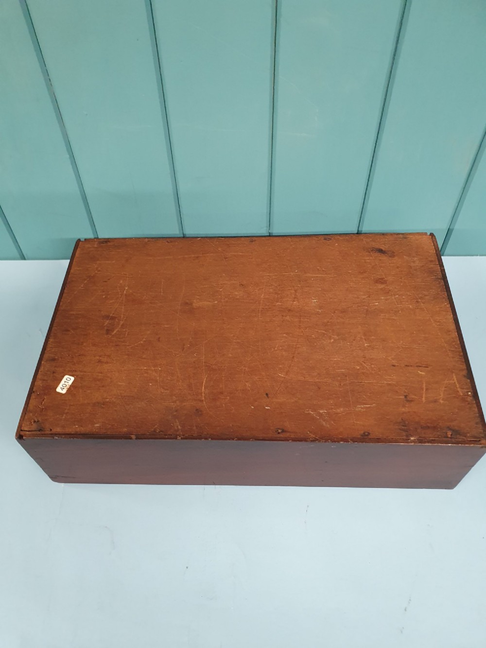 A rectangular Georgian mahogany document box featuring a sliding lid mechanism and warm brown wood grain finish. View VI
