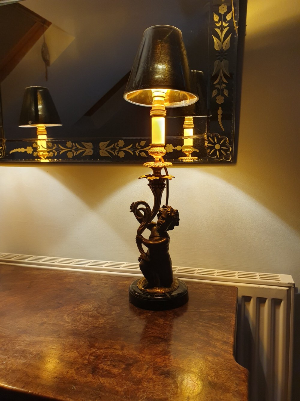A pair of 1920s French-style dark bronze cherub table lamps with gilt foliate stems set on round black marble bases. View XI