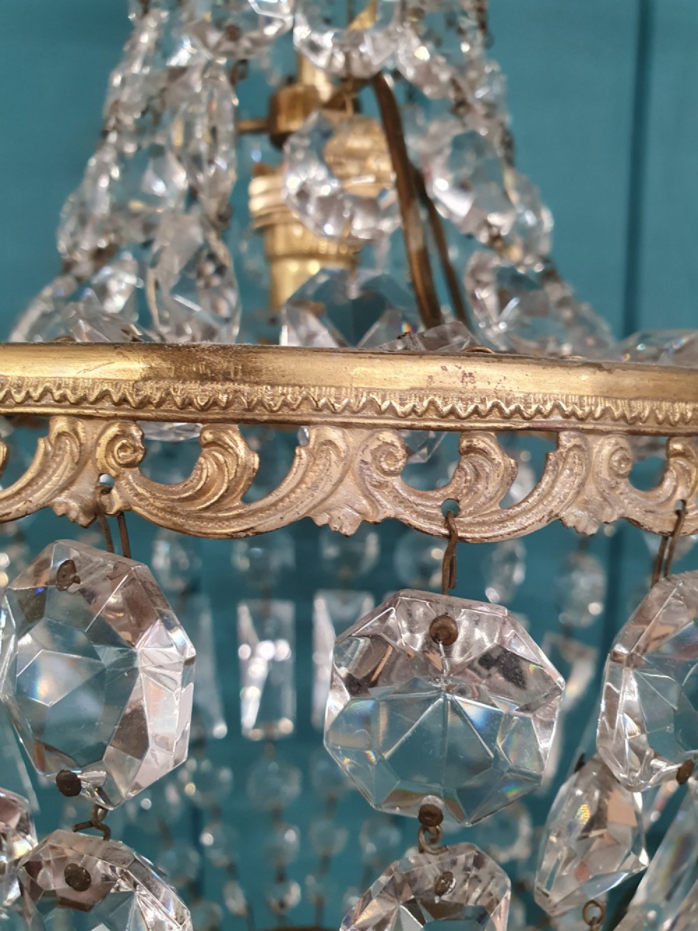 A pair of early 20th-century tent-style chandeliers featuring tier upon tier of faceted cut glass crystal beads and brass fittings. View III