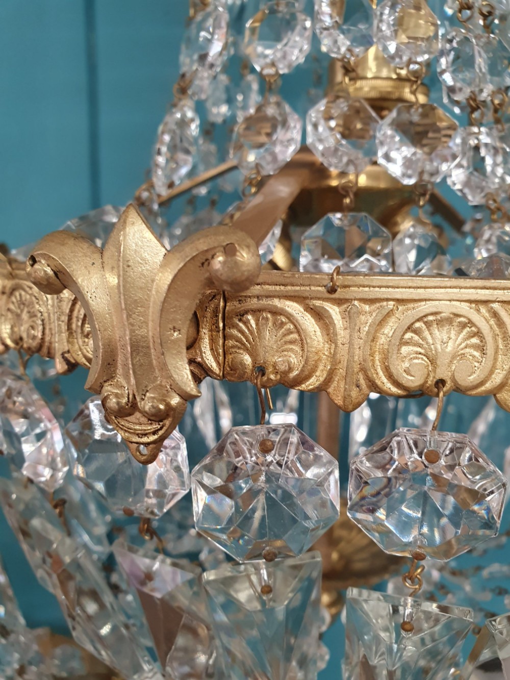 A pair of early 20th-century cut glass and brass tent chandeliers featuring tapered crystal bead strands and a lower band of rectangular faceted prisms. View III