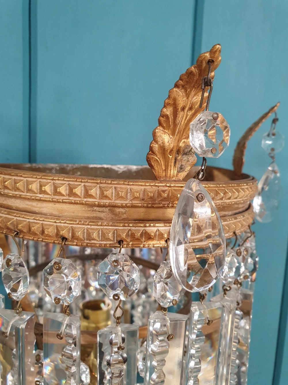 A pair of antique gilt brass wall lights with cascading tiers of cut glass crystal prisms. View III