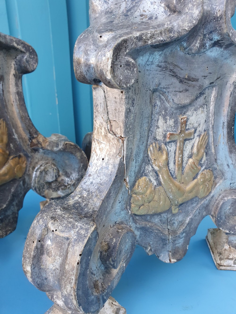 Pair of tall 18th-century Rococo gilt-silver pricket candlesticks with carved baluster shafts and scrolled triangular bases. View V