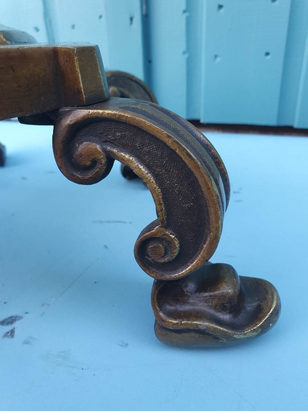 An antique bronze standard floor lamp featuring a turned baluster column, urn knop, and scrolled feet on a square stepped base. View VI