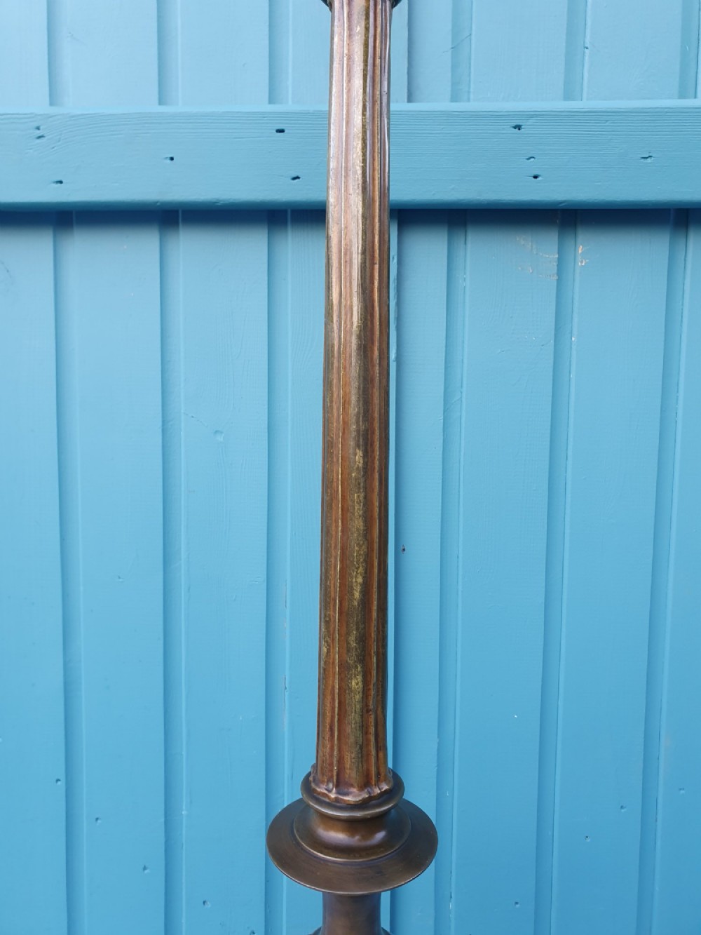 An antique bronze standard floor lamp featuring a turned baluster column, urn knop, and scrolled feet on a square stepped base. View VII