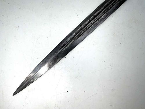 A German Kriegsmarine officer dress dagger featuring a cream wire-wrapped grip, spherical eagle pommel, crossguard, and an engraved brass scabbard with two suspension rings. View X