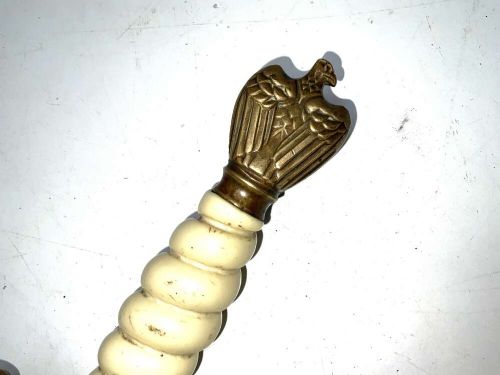 A German Kriegsmarine officer dress dagger featuring a cream wire-wrapped grip, spherical eagle pommel, crossguard, and an engraved brass scabbard with two suspension rings. View XII