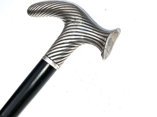 A Victorian dark wood walking cane featuring a decorative silver handle and a brass protective ferrule at the base. View II