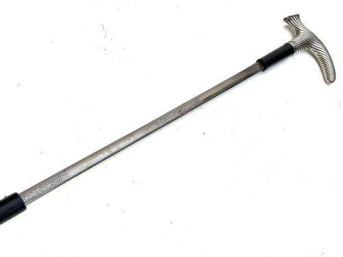 A Victorian dark wood walking cane featuring a decorative silver handle and a brass protective ferrule at the base. View IV