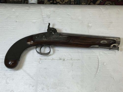 A pair of nineteenth-century percussion pistols featuring dark walnut stocks, octagonal steel barrels, engraved lockplates, and captive swivel ramrods. View V