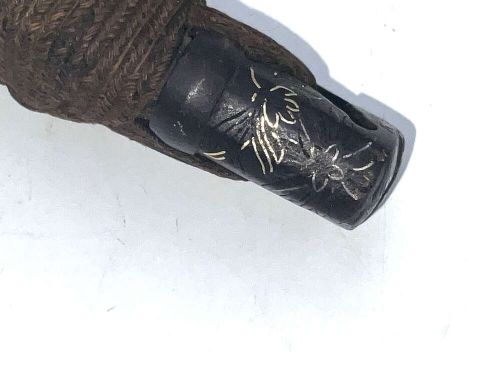 An 18th-century Japanese Wakizashi samurai sword featuring a textured black lacquered scabbard, round iron tsuba, and wrapped handle. View V