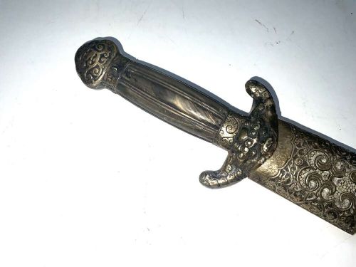 A Chinese double-edged Jian sword resting inside a detailed metal-mounted scabbard. View II