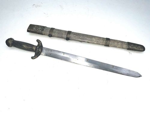 A Chinese double-edged Jian sword resting inside a detailed metal-mounted scabbard. View VI