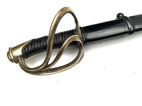 An antique 19th-century military cavalry sabre featuring a brass three-branch handguard, leather-wrapped grip, and black metal scabbard. View II