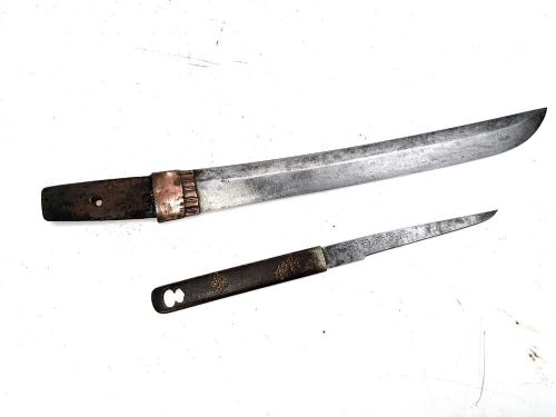 An Edo period Japanese samurai tanto dagger enclosed in a black lacquered wood scabbard with a wrapped handle. View III