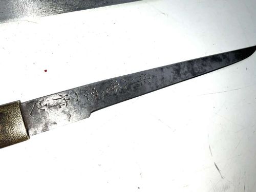 An Edo period Japanese samurai tanto dagger enclosed in a black lacquered wood scabbard with a wrapped handle. View IV