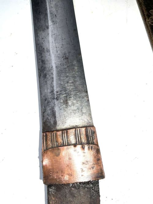 An Edo period Japanese samurai tanto dagger enclosed in a black lacquered wood scabbard with a wrapped handle. View VI