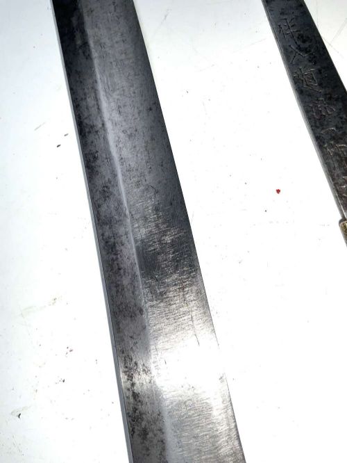 An Edo period Japanese samurai tanto dagger enclosed in a black lacquered wood scabbard with a wrapped handle. View VIII