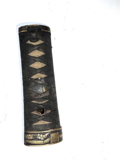 An Edo period Japanese samurai tanto dagger enclosed in a black lacquered wood scabbard with a wrapped handle. View XI