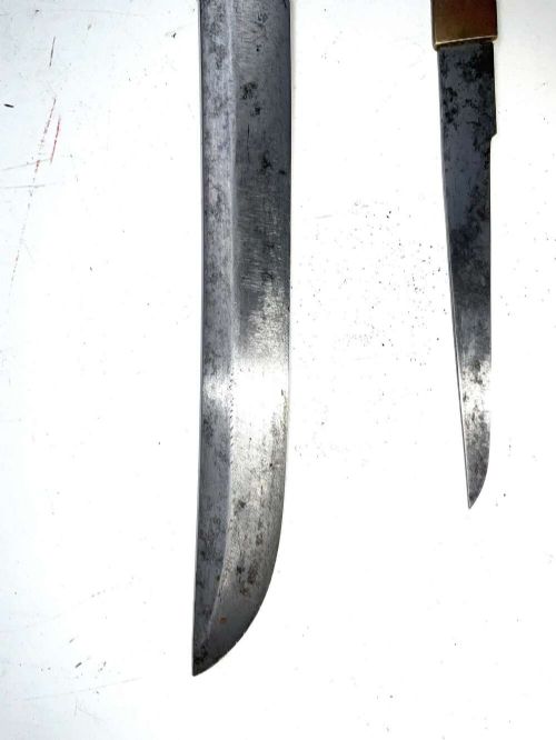 An Edo period Japanese samurai tanto dagger enclosed in a black lacquered wood scabbard with a wrapped handle. View XII