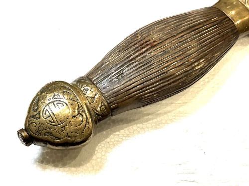 An antique 19th-century Chinese Jian sword featuring a double-edged steel blade, fluted wooden grip, and decorative brass fittings. View II