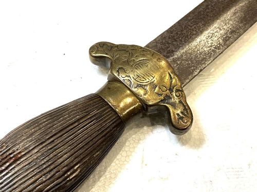 An antique 19th-century Chinese Jian sword featuring a double-edged steel blade, fluted wooden grip, and decorative brass fittings. View III