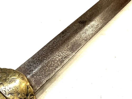 An antique 19th-century Chinese Jian sword featuring a double-edged steel blade, fluted wooden grip, and decorative brass fittings. View V