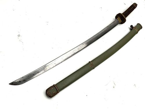 A Second World War Japanese officer sword in an olive green metal scabbard with brass fittings and a bound handle. View IV