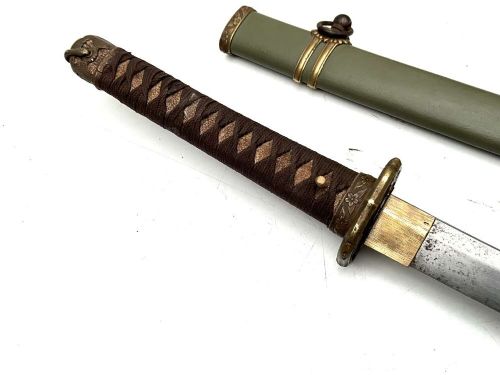 A Second World War Japanese officer sword in an olive green metal scabbard with brass fittings and a bound handle. View V