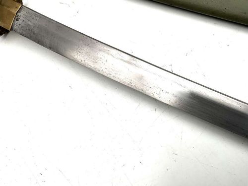 A Second World War Japanese officer sword in an olive green metal scabbard with brass fittings and a bound handle. View VI