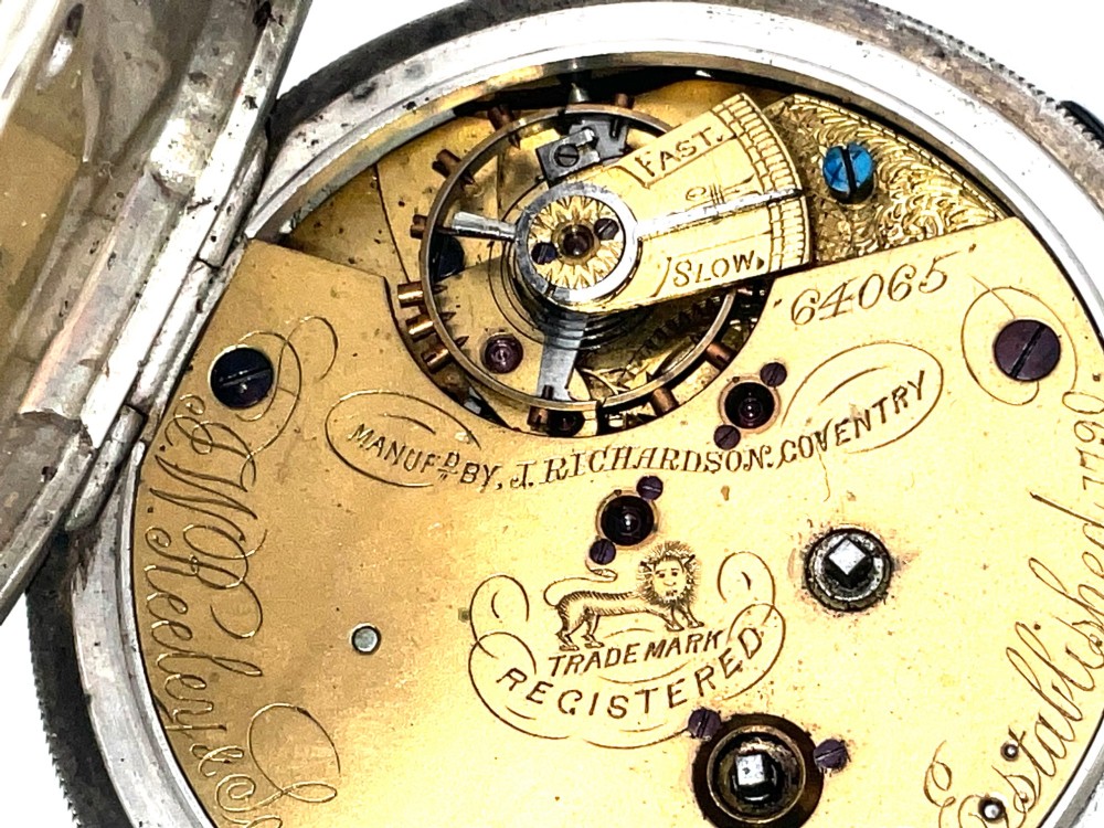An antique silver open-face pocket watch featuring a white enamel dial with Roman numerals, centre seconds chronograph markings, and an attached top suspension loop. View VIII