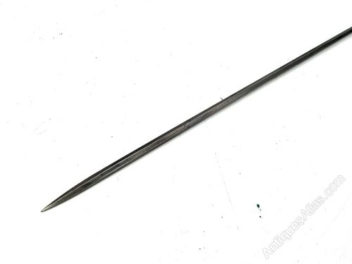 An antique gentlemens partridge wood walking stick unsheathed to reveal a long, thin steel blade. View VI