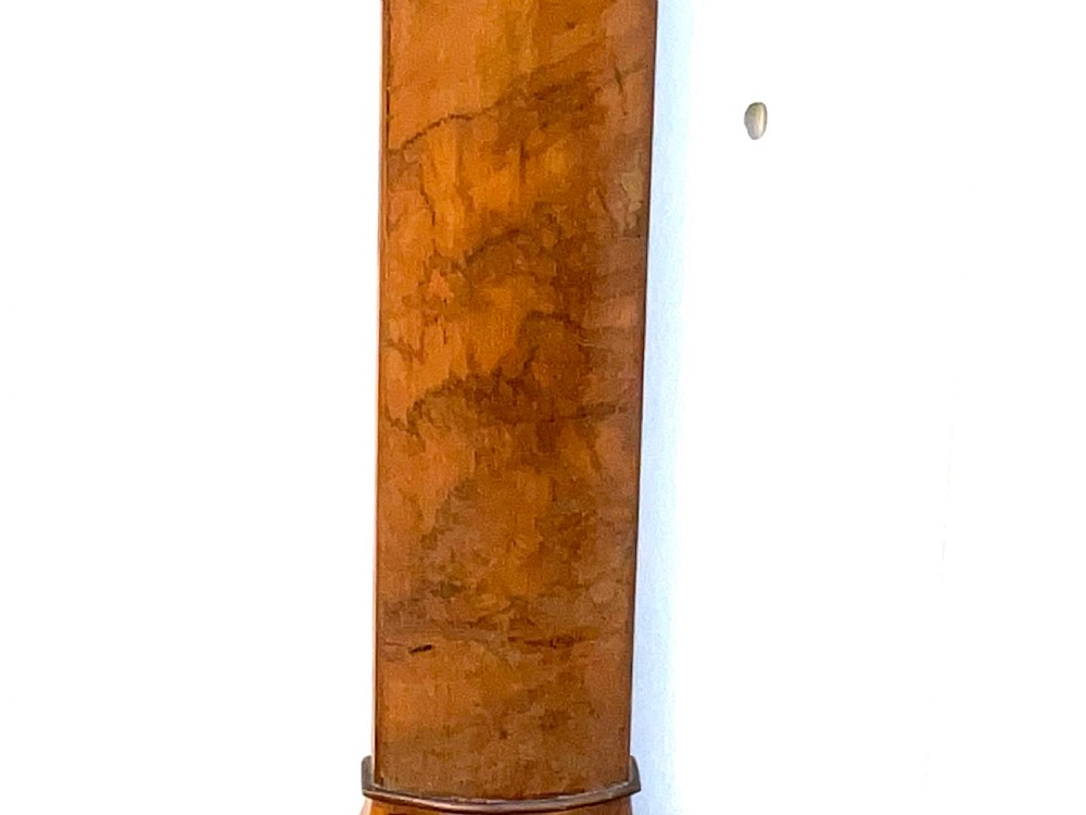 A wall-mounted antique Georgian stick barometer crafted from figured satinwood, featuring a brass finial, pediment top, and glass-fronted silvered scale. View V